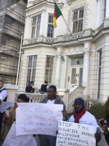 From let to right Pride Mbi Agbor,Alain Bougan SCNC activist demonstrating at the Cameroonian high commissioner in London on the 25 Nov 2016 